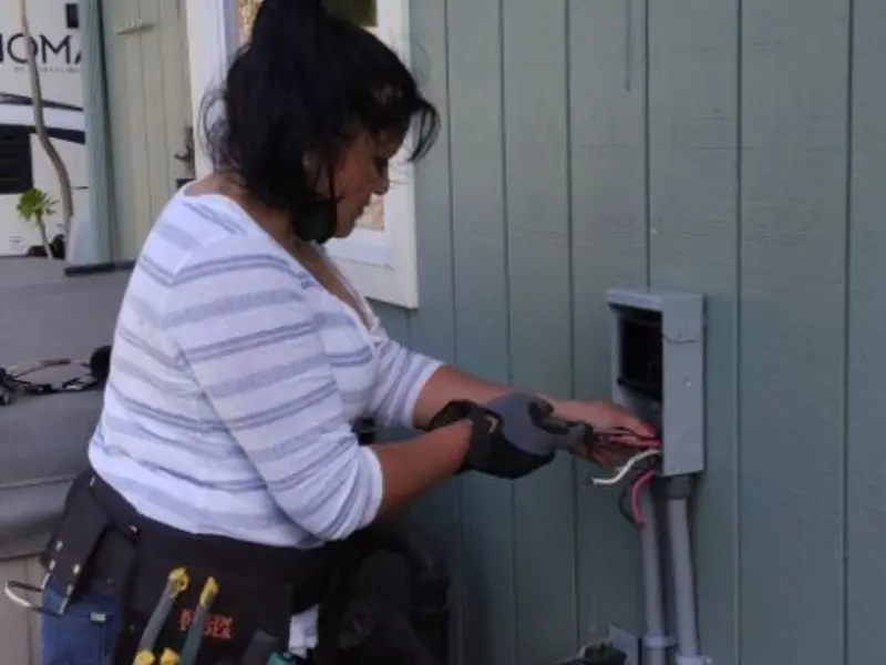 Licensed electrician wiring an exterior subpanel in Orinda