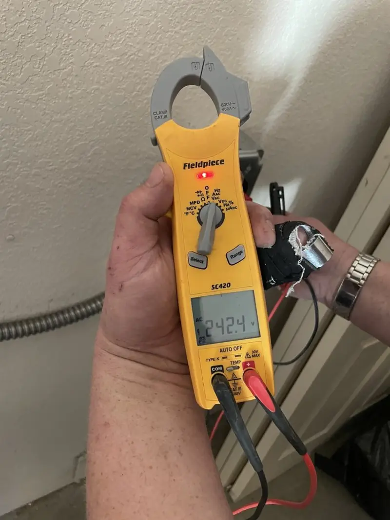 Voltage testing with clamp meter during Outlet Installation in Orinda